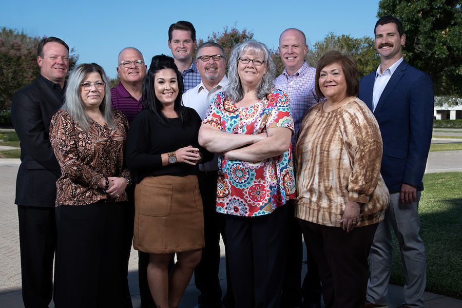 About Our Agency - Group Shot of the Fortis Insurance Partners Team Standing Together and Smiling While Outside